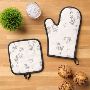 a black and white photo of bubbles on a white back oven mitt & pot holder set