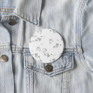 a black and white photo of snow flakes 7.5 cm round badge