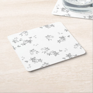 a black and white photo of snow flakes square paper coaster