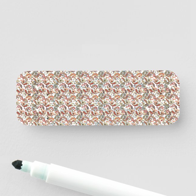 a black background with a red, green and blue patt name tag (In Situ)