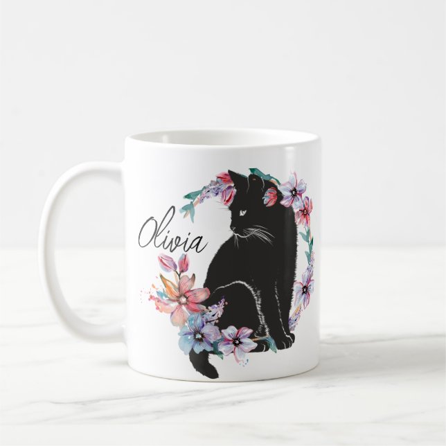 A black cat surrounded by flowers  coffee mug (Left)