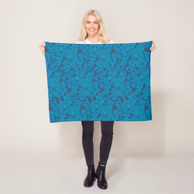 a blue and black background with a pattern fleece blanket (In Situ)