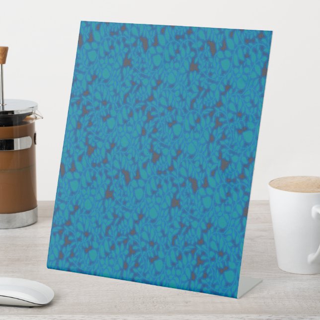 a blue and black background with a pattern pedestal sign (In SItu)