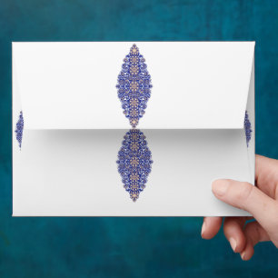 a blue and gold pattern on a white background envelope