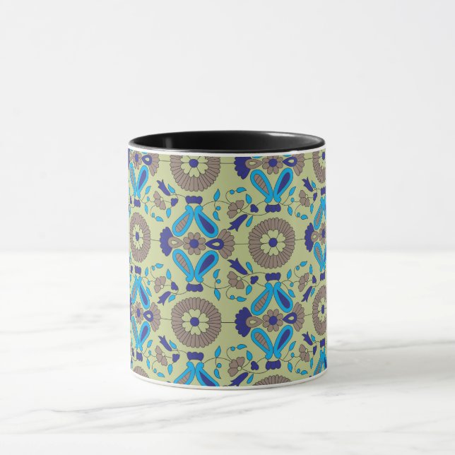 a blue and green pattern on a green background mug (Center)