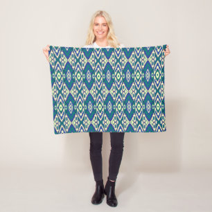 a blue and green pattern with a white background fleece blanket