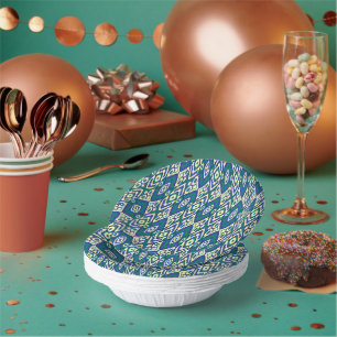 a blue and green pattern with a white background paper plate
