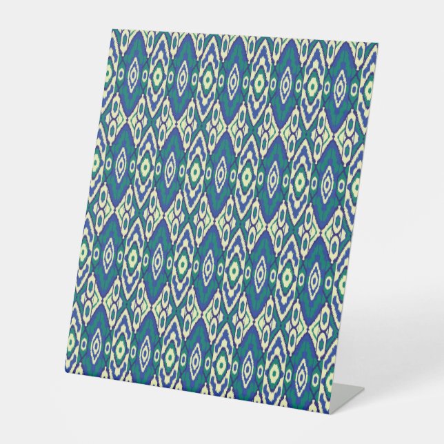 a blue and green pattern with a white background pedestal sign (Front)