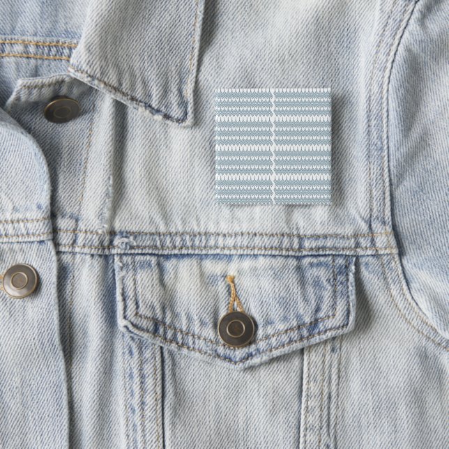 a blue and white pattern with a white background 15 cm square badge (In Situ)