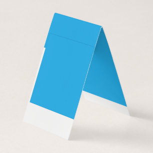 a blue background with a black and white cat business card