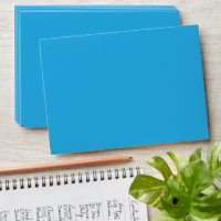 a blue background with a black and white cat