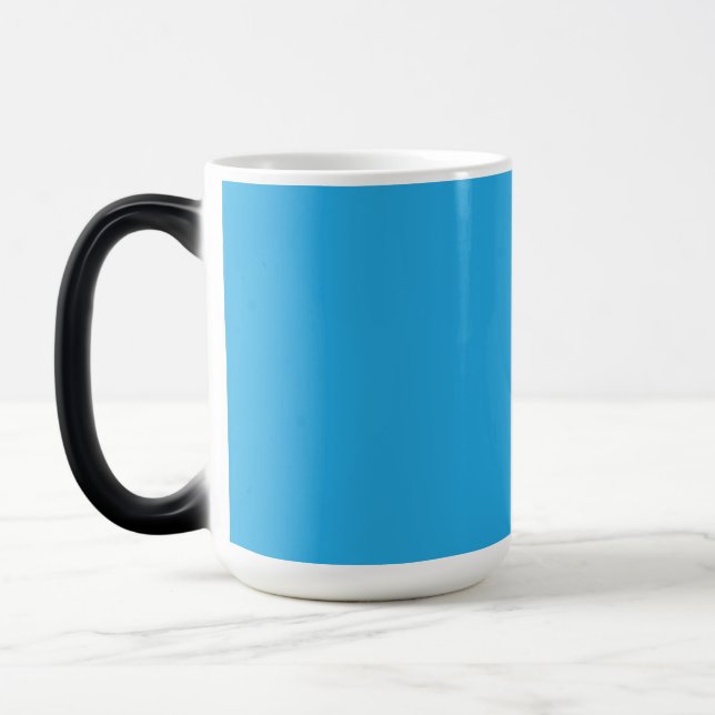 a blue background with a black and white cat magic mug (Left)