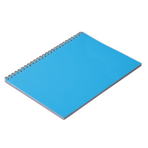 a blue background with a black and white cat notebook