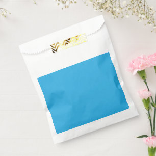 a blue background with a black and white cat on to favour bag