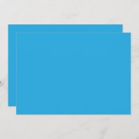 a blue background with a black and white cat on to