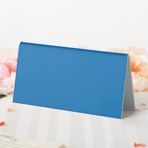 a blue background with a black and white clock