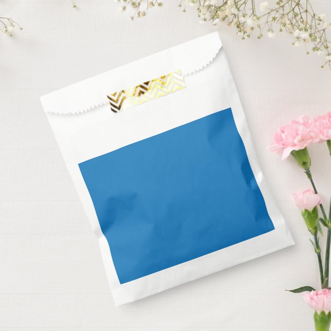 a blue background with a black and white clock favour bag (Sealed)