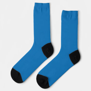 a blue background with a black and white clock socks