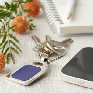 a blue background with a clock on it key ring