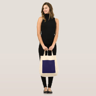 a blue background with a clock on it tote bag