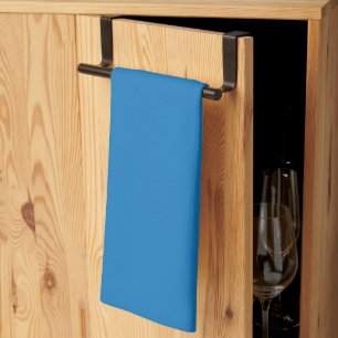 a blue background with a tea towel