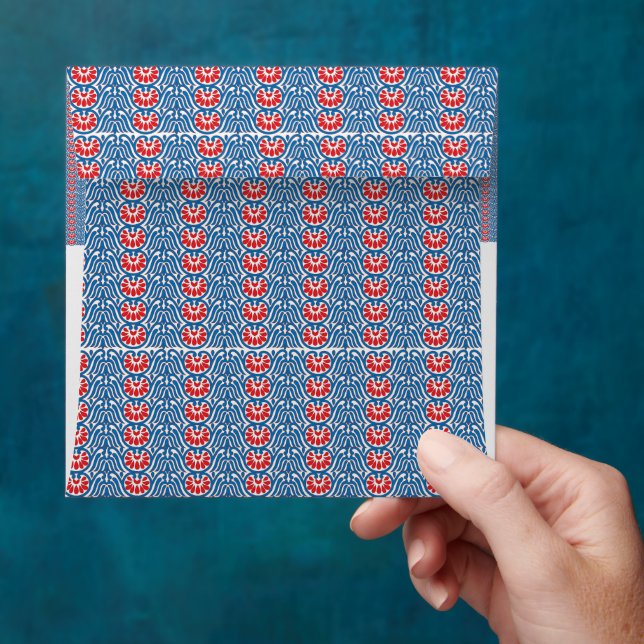 a blue background with red and white designs envelope (Hand)