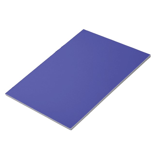 a blue wall with a clock on it notepad (Angled)