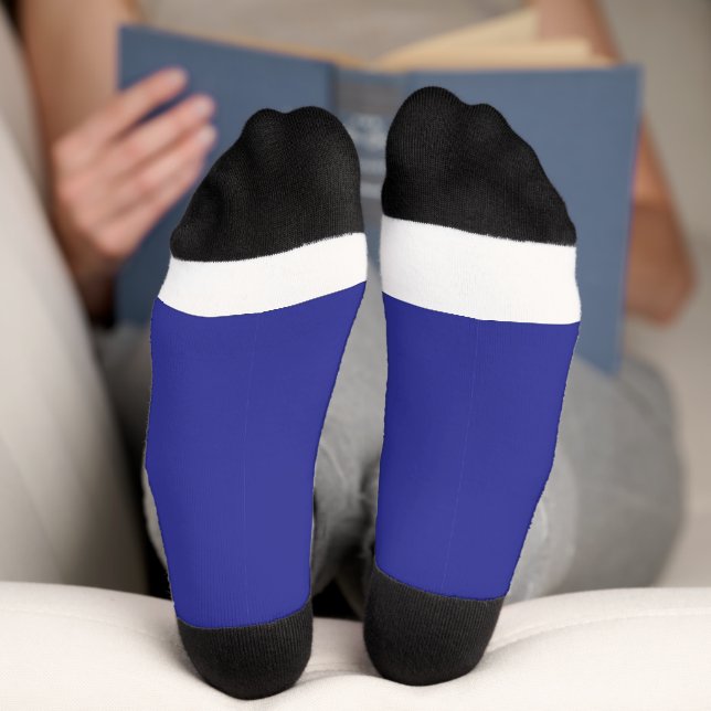 a blue wall with a clock  socks (Bottom)