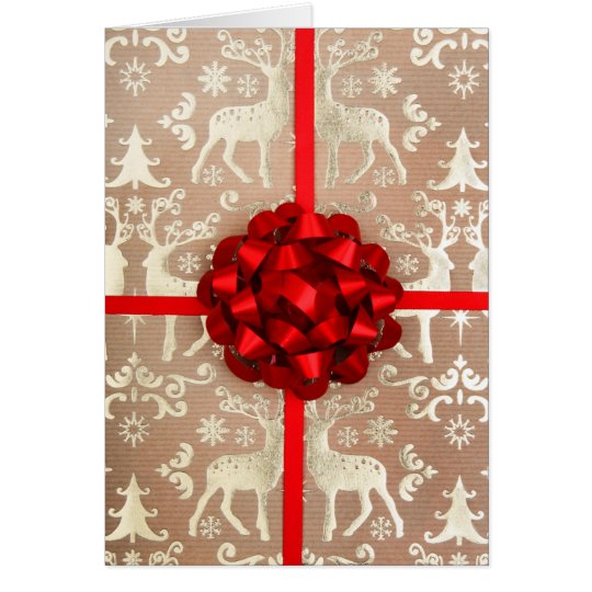 A bow and ribbon on Christmas wrapping paper Card