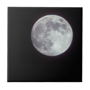 A bright full moon in a black night sky ceramic tile
