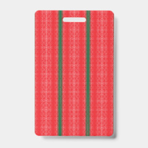 A bright red apple sits on a plain white surface. ID badge