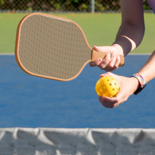 a brown and beige striped background pickleball paddle