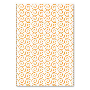 A brown and orange rug with a repeating pattern mo table number