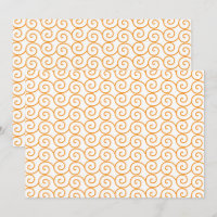 A brown and orange rug with a repeating pattern mo