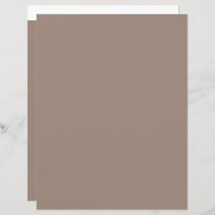 a brown wall with a clock on it