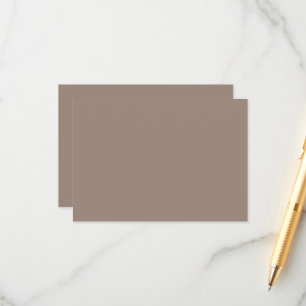 a brown wall with a enclosure card