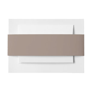 a brown wall with a invitation belly band
