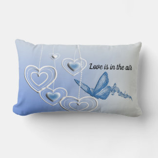 A butterfly and hearts lumbar cushion