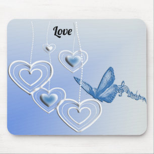 A butterfly and hearts mouse pad
