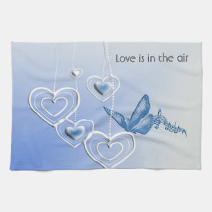 A butterfly and hearts tea towel