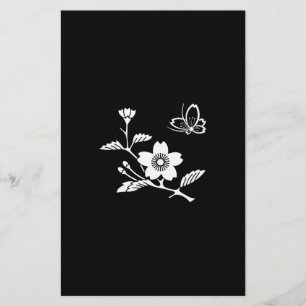 A butterfly in the middle of a cherry tree stationery