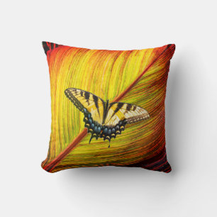 A butterfly with yellow and black wings cushion
