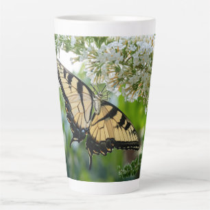 A butterfly with yellow and black wings latte mug