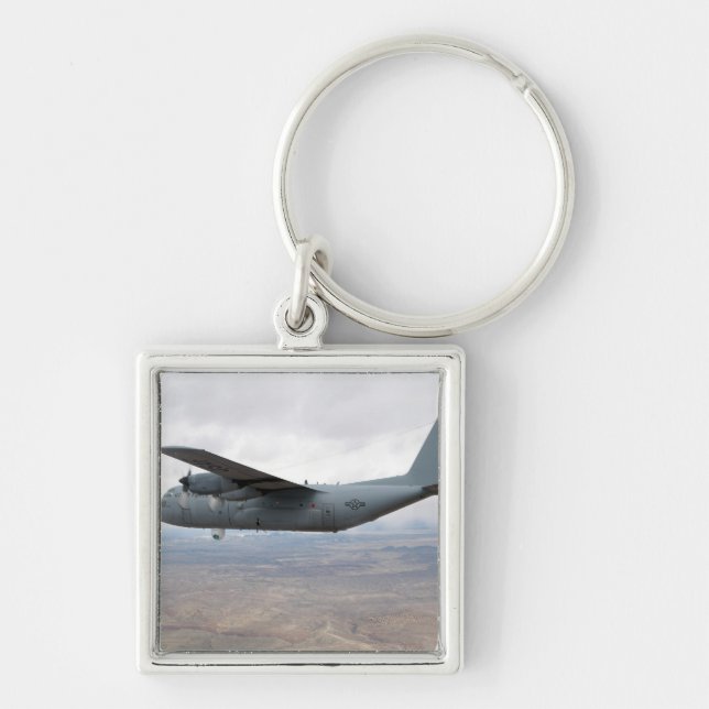 A C-130 Hercules soars through the sky Key Ring (Front)