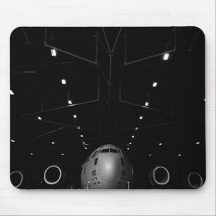 A C-17 Globemaster III sits in a hangar Mouse Pad