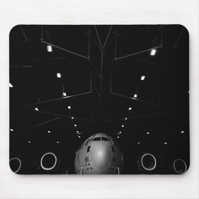 A C-17 Globemaster III sits in a hangar Mouse Pad (Front)