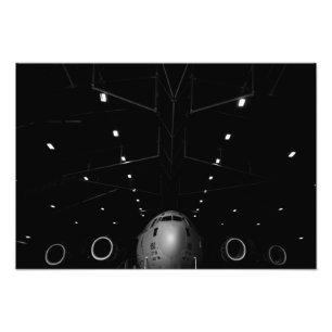 A C-17 Globemaster III sits in a hangar Photo Print