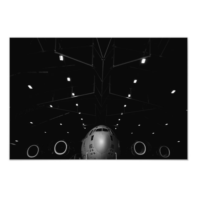 A C-17 Globemaster III sits in a hangar Photo Print (Front)