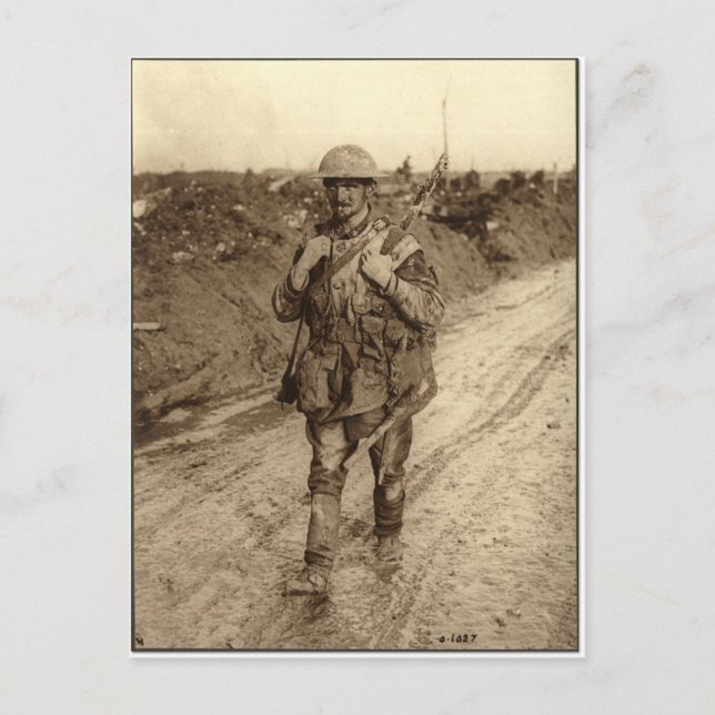 A Canadian Tommy soldier covered in mud returning Postcard (Front)