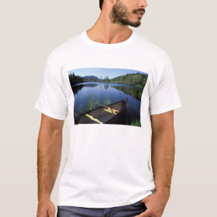 A canoe rests on the shore of Little Long Pond T-Shirt